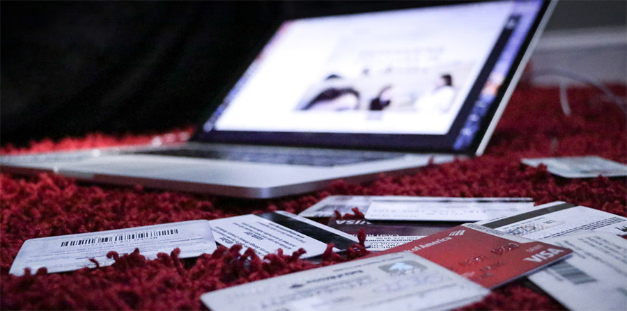 laptop with credit cards in foreground